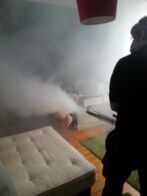 Fogging A pest control technician fogging a bedroom
